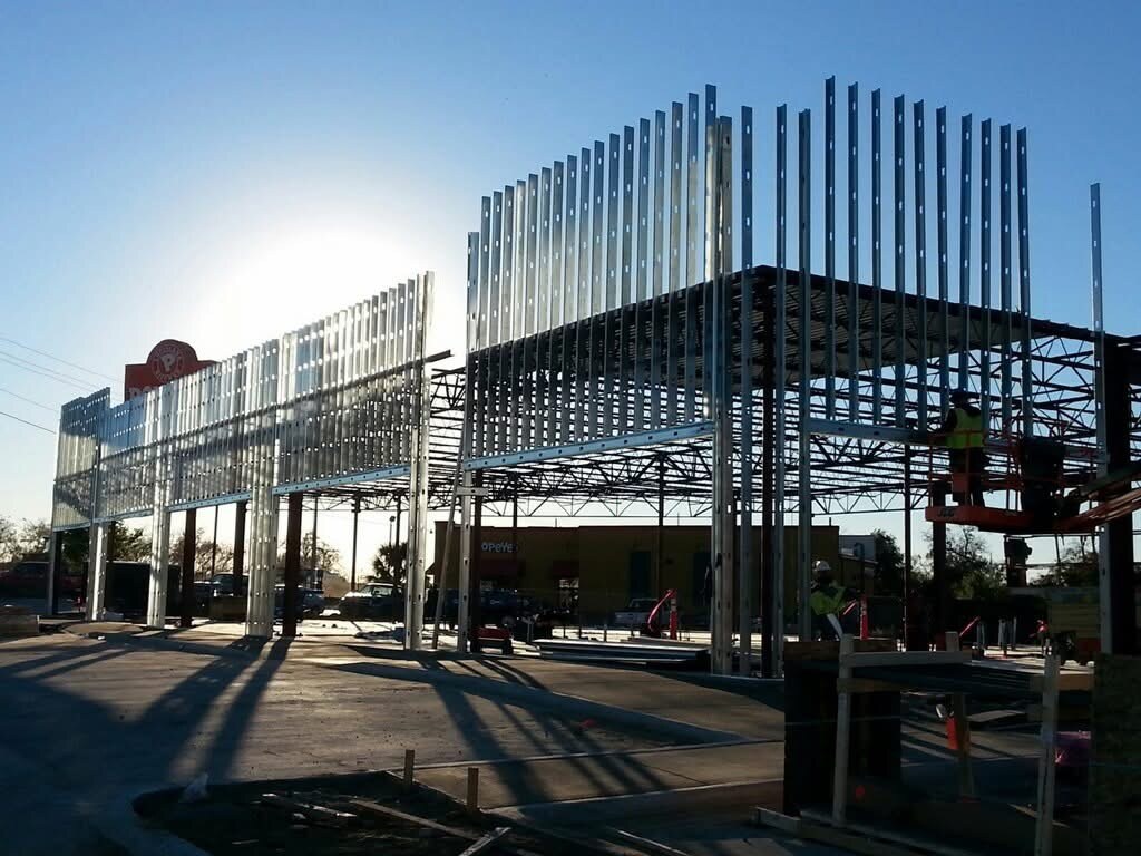 Exterior metal stud framing on a commercial construction site