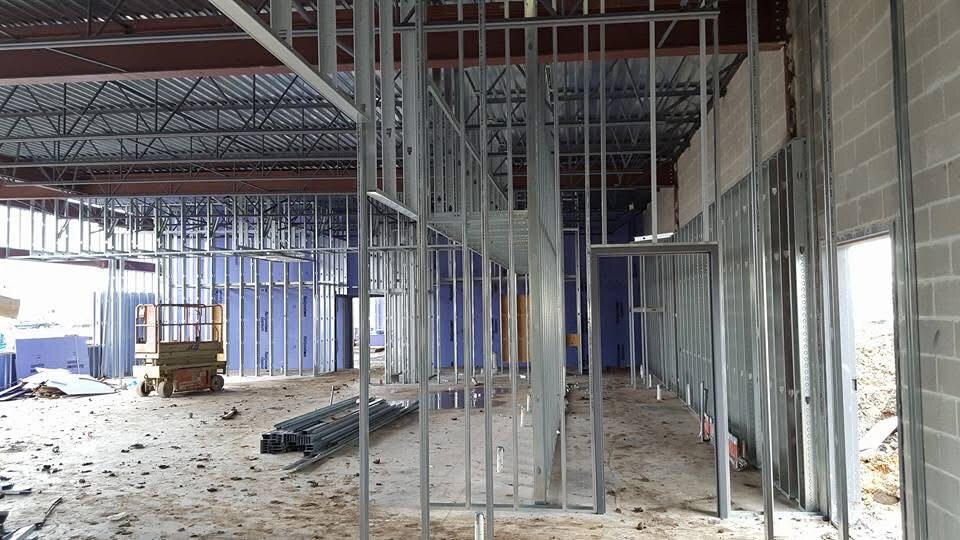 Metal stud partitions and door openings inside a commercial building